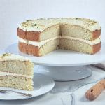 Coconut and Lime Cake sliced and on a cake stand